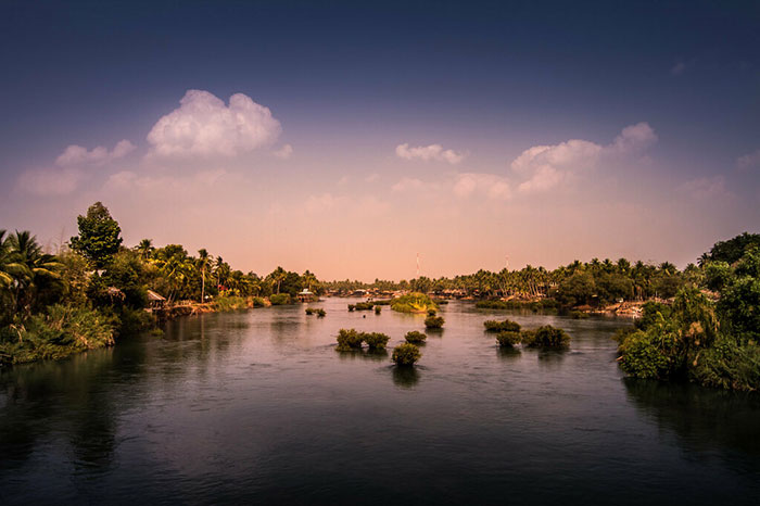 Palm-fringed channels of the Mekong River winding through the 4000 Islands (Si Phan Don) at sunset, Laos