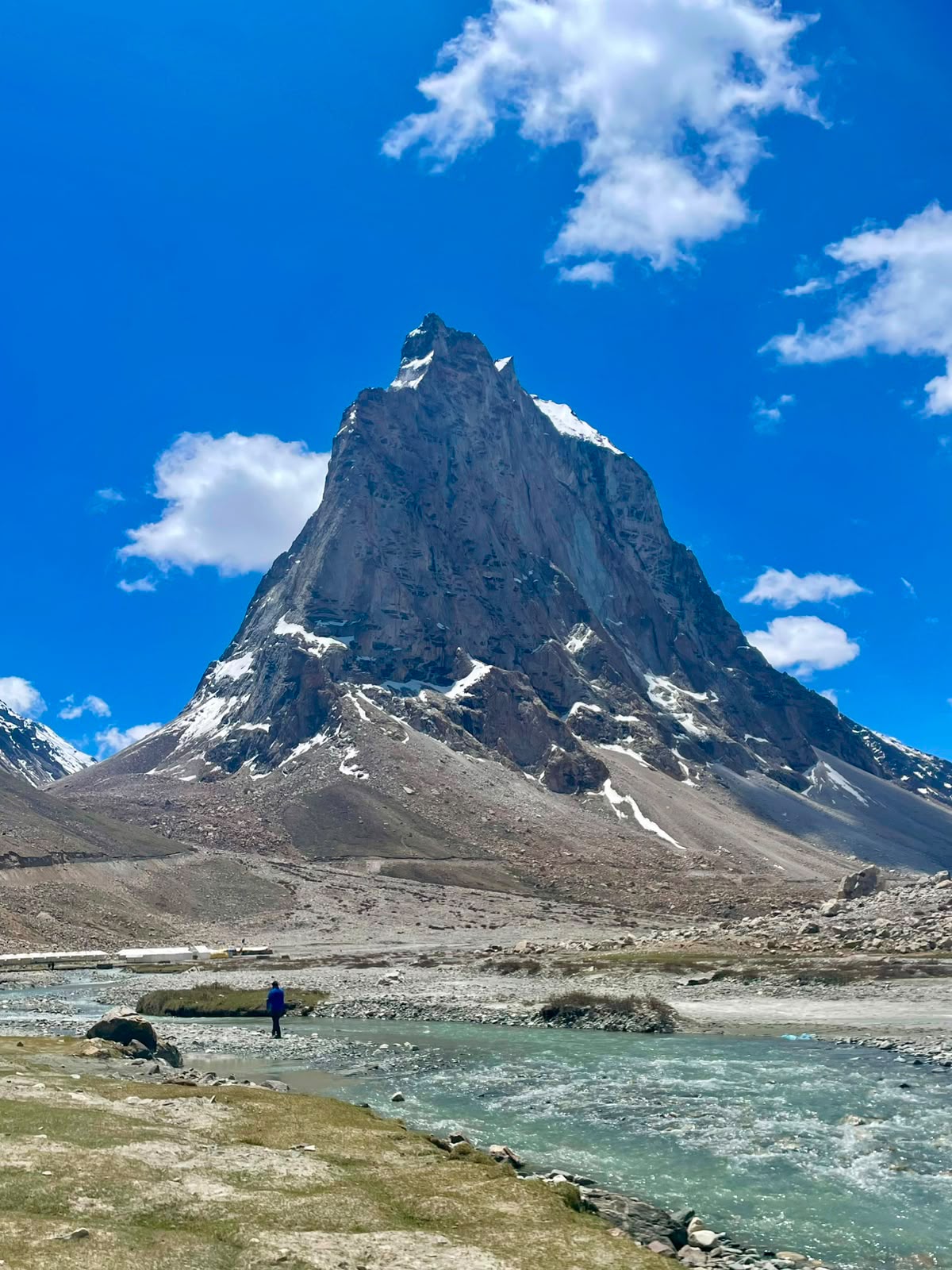 Zanskar Valley Tour Package: dramatic rock spires and river along the Shinkula Pass route